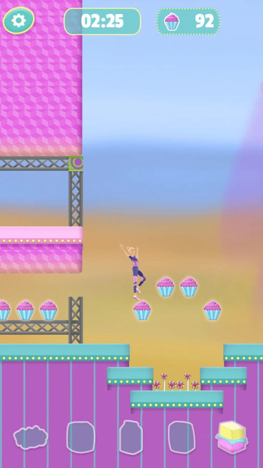 Barbie mid-leap in open air between steel gantries, reaching for a cluster of four cupcakes, with 2:25 on the clock and 92 cupcakes collected